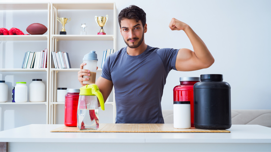 A man stands holding various bottles of workout supplements, each labeled with different flavors. He has a contemplative expression as he decides which one to try next, reflecting the diversity of choices in the fitness industry.